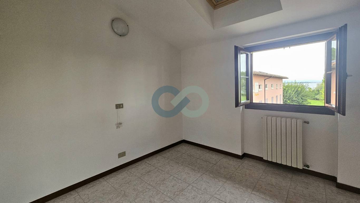 TRILOCALE MANSARDATO 24