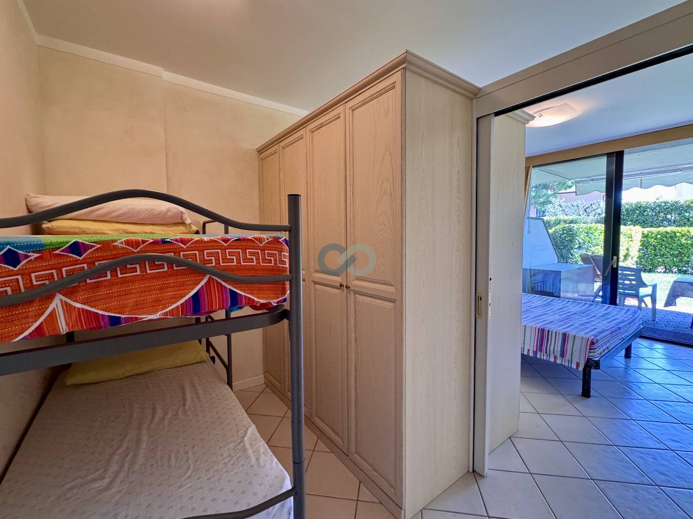 BILOCALE CON GIARDINO IN RESIDENCE CON PISCINA 29